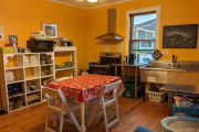 Kitchen for your use including: range with hood, microwave, toaster, refrigerator, dry goods storage, sink, dining table - Asheville Nurse Guest House at avlnurse.com