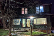 The exterior of the Asheville Nurse Guest House at night